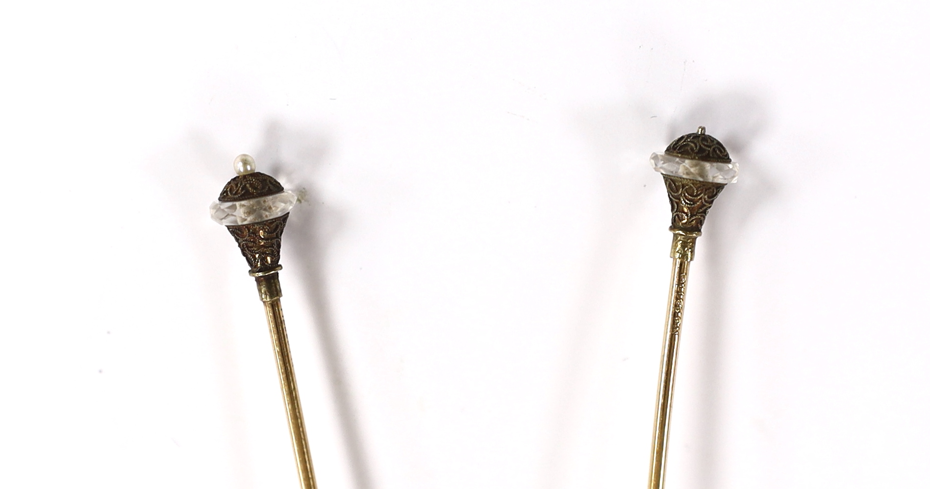 A pair of seed pearl set 'filled pin' hatpins, one a.f.